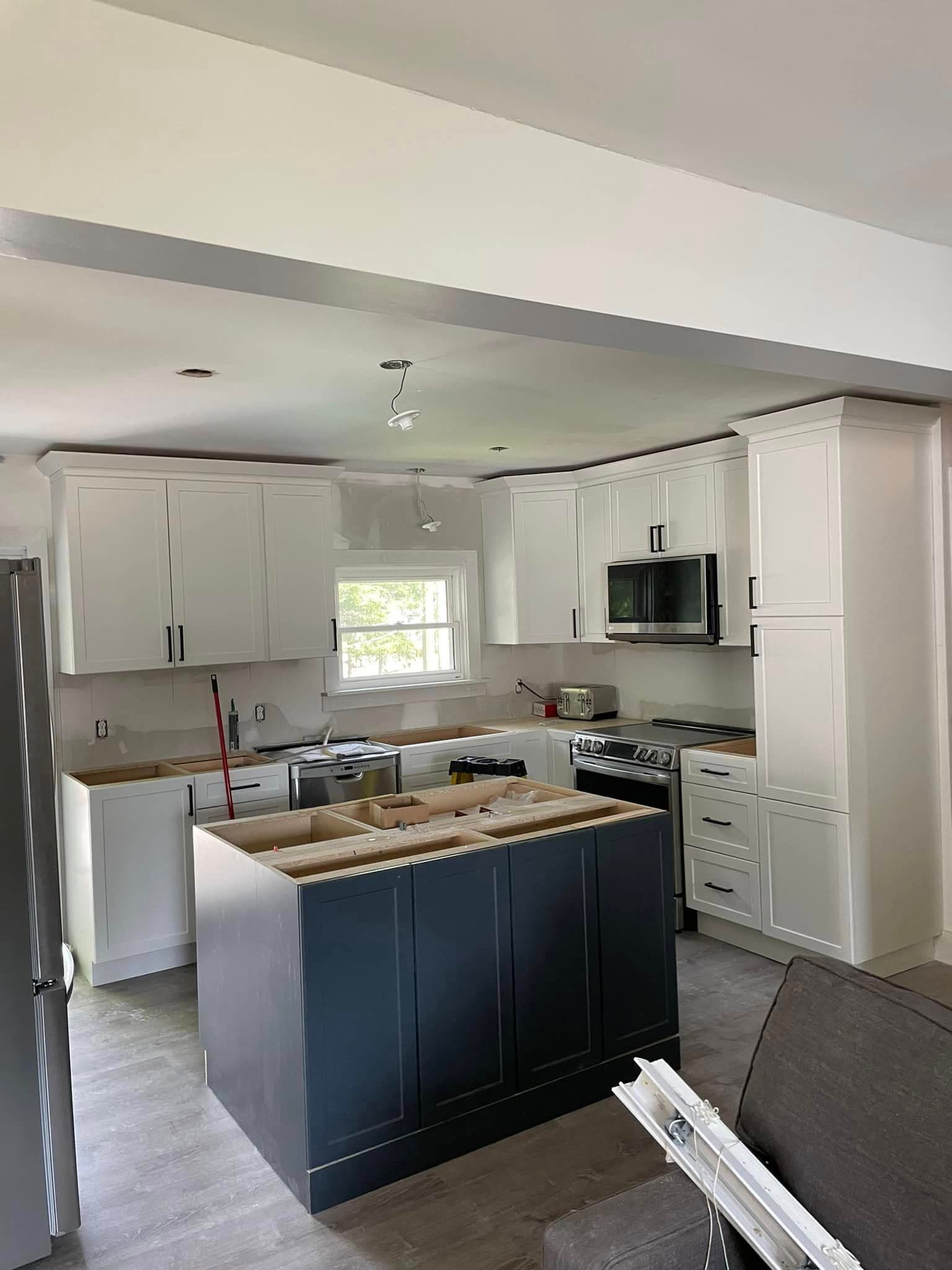 Renovated kitchen with new cabinetry and finishes